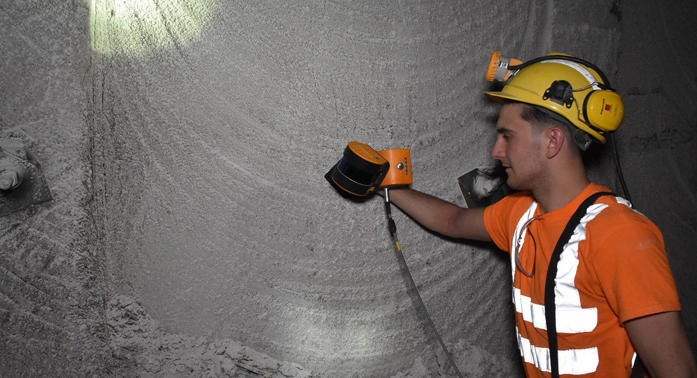 Man in hi-vis capturing a control point with a mobile LiDAR scanner