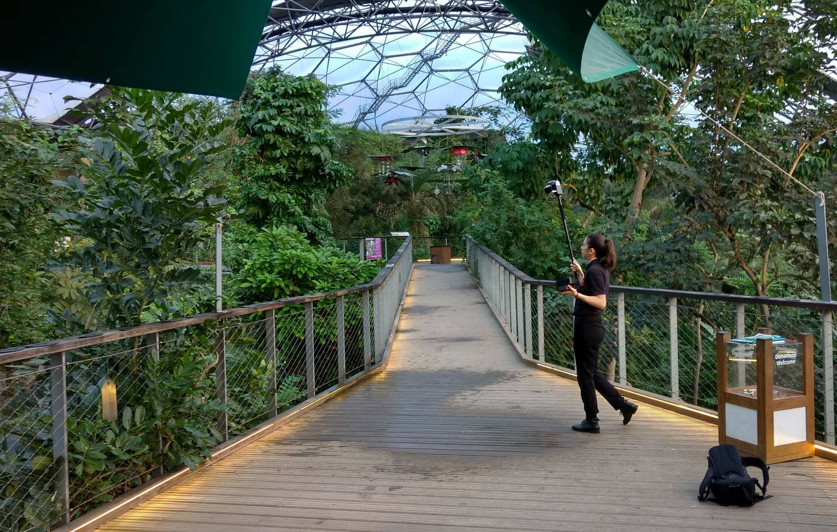 Surveyor mapping an indoor forest with mobile LiDAR on a pole