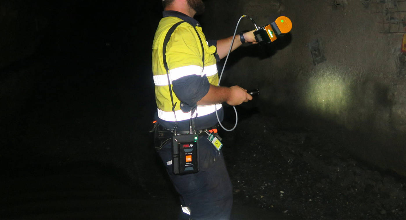 Man scanning with a mobile LiDAR solution in a mine