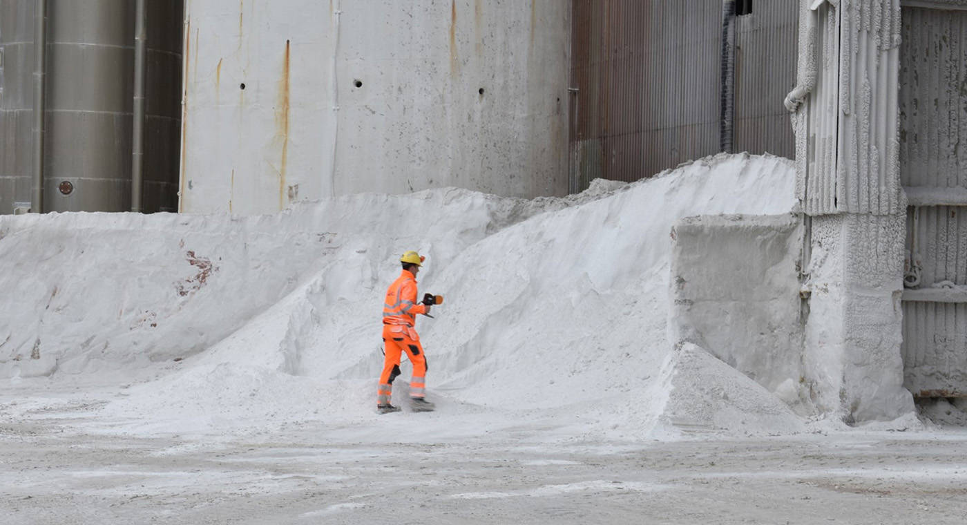 A man using a mobile LiDAR solution to map a stockpile